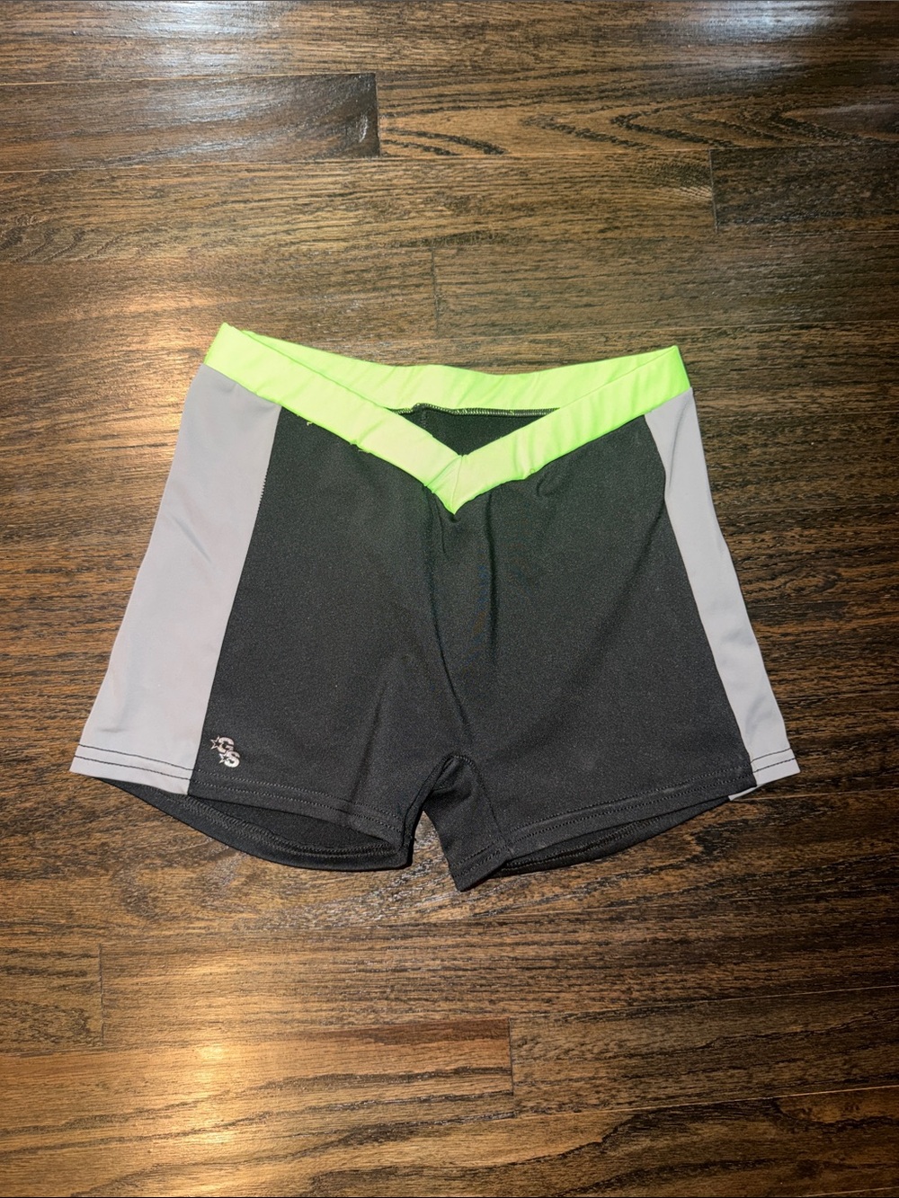 Black Athletic Shorts with Neon Green Waistband and Gray Side Panels